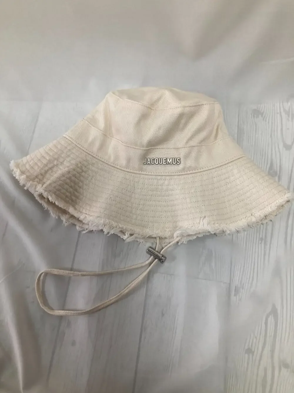 Jacquemus Cream Frayed Brim Bucket Hat Metal Logo Adjustable Chin Strap
